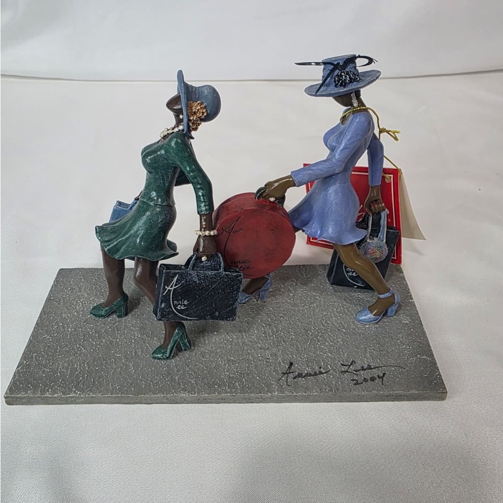 “Power Shopping” collectible figurine Signed